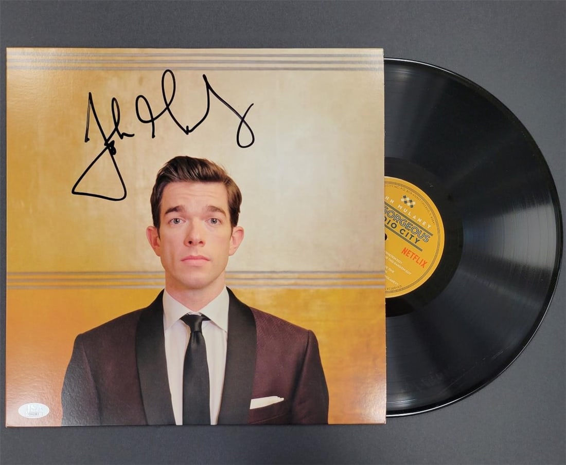 John Mulaney Signed Kid Gorgeous Album Cover Photo JSA Authenticated: John Mulaney Signed Kid Gorgeous Album Cover Photo JSA Authenticated This is an original album cover of John Mulaney's 'Kid Gorgeous at Radio City,' featuring his autograph, authenticated by James Spe