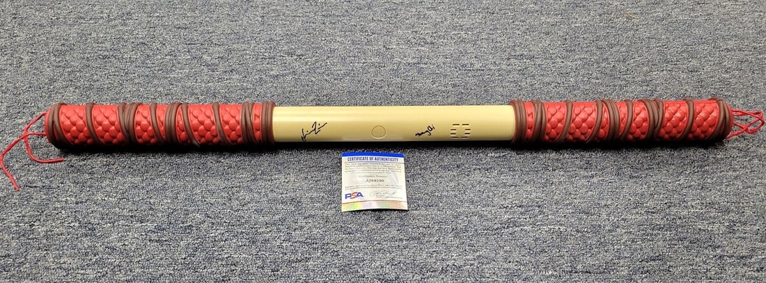 Simu Liu Signed Shang-Chi Staff Prop with PSA/DNA Authentication: Simu Liu Signed Shang-Chi Staff Prop with PSA/DNA Authentication This is an original staff prop from the movie "Shang-Chi and the Legend of the Ten Rings," signed by actor Simu Liu. The autograph has 