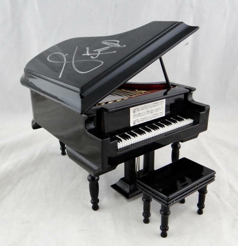 Mini Piano Signed by Jamie Foxx from Ray with JSA Authentication: Mini Piano Signed by Jamie Foxx from Ray with JSA Authentication This mini piano is autographed by Jamie Foxx and is associated with the movie "Ray." The autograph is authenticated by James Spence Aut