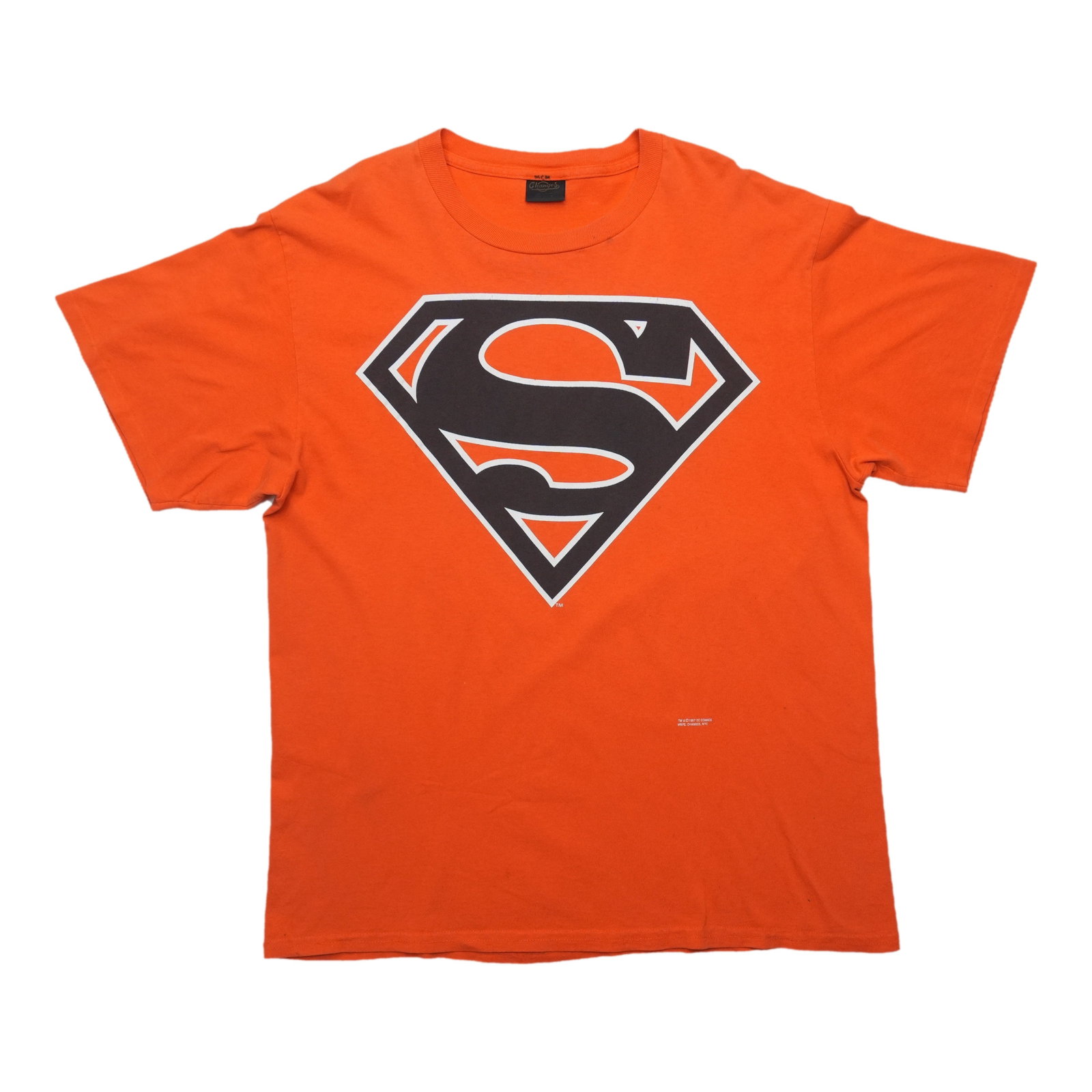 Vintage Orange Superman Graphic Cotton Shirt Large 1990s: Vintage Orange Superman Graphic Cotton Shirt Large 1990s This is an original vintage Superman Shield Logo shirt from the 1990s, featuring a bold front graphic of the iconic emblem. The shirt is made f