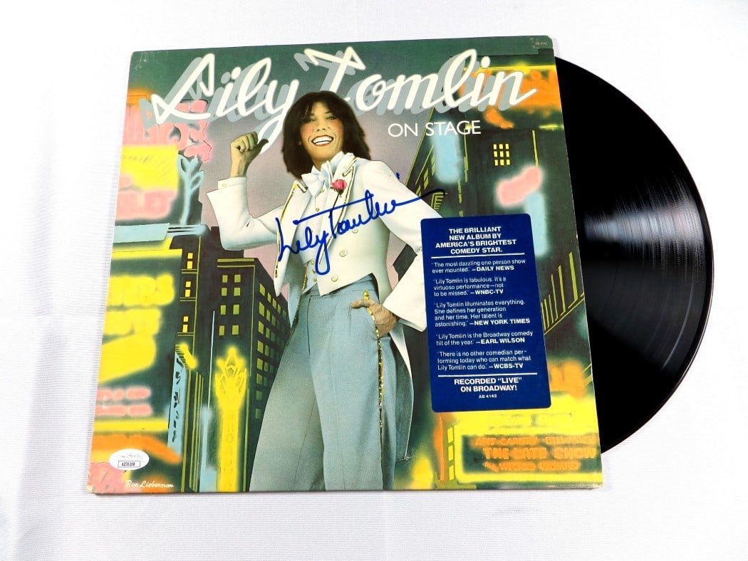 Lily Tomlin Autographed Record Album Cover JSA Authentication: Lily Tomlin Autographed Record Album Cover JSA Authentication This is an original signed record album cover by the iconic comedian and actress Lily Tomlin. The album comes with authentication from Jam