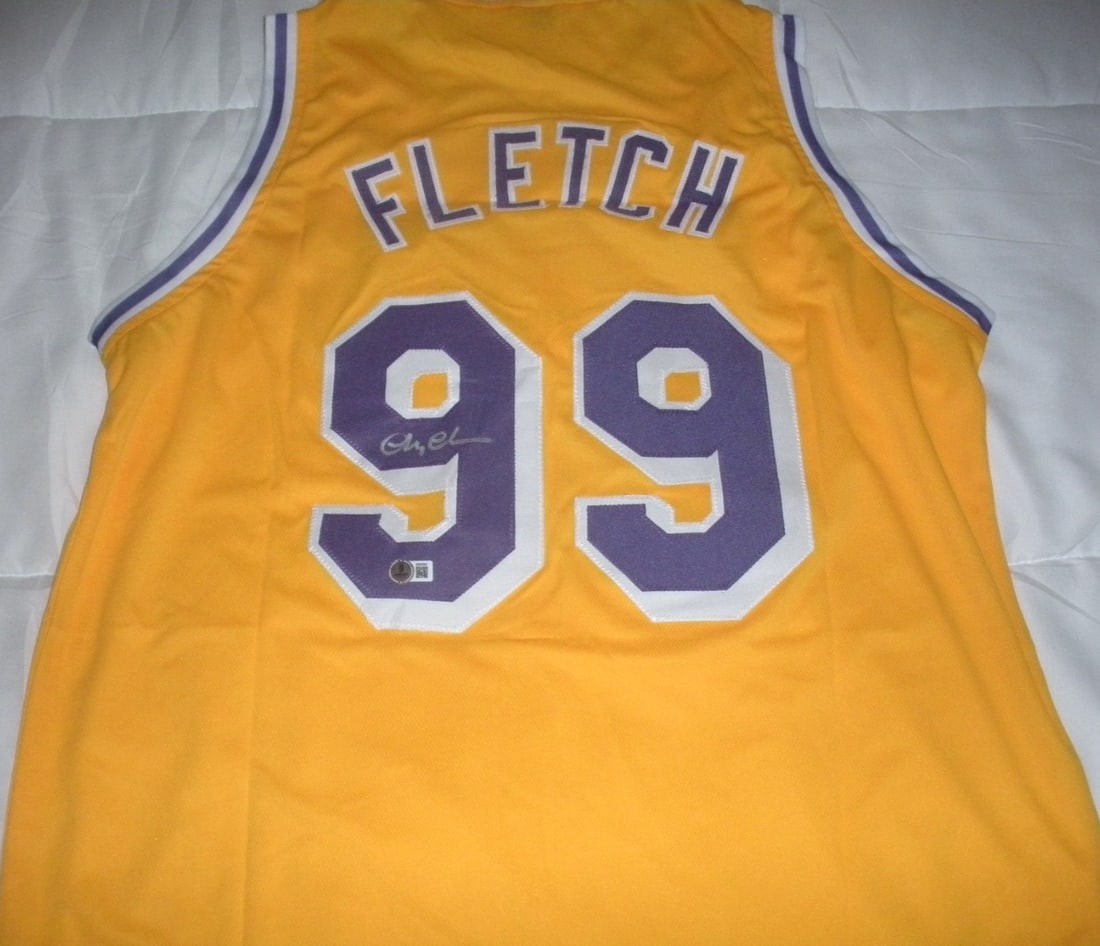 Signed Jersey with Beckett COA Featuring Chevy Chase from Fletch: Signed Jersey with Beckett COA Featuring Chevy Chase from Fletch This is a pre-owned yellow jersey signed by the famous actor Chevy Chase, known for his role in "Fletch." The jersey is an original ite