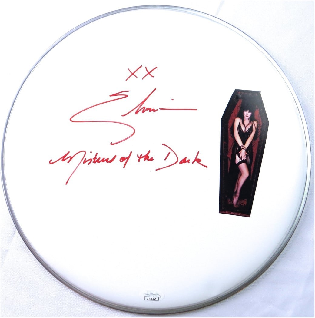 Elvira Mistress of the Dark Signed 12 Inch Drumhead With JSA Authentication: Elvira Mistress of the Dark Signed 12 Inch Drumhead With JSA Authentication This 12" drumhead is hand-signed by Elvira, Mistress of the Dark, and features an inscription. The autograph has been authen