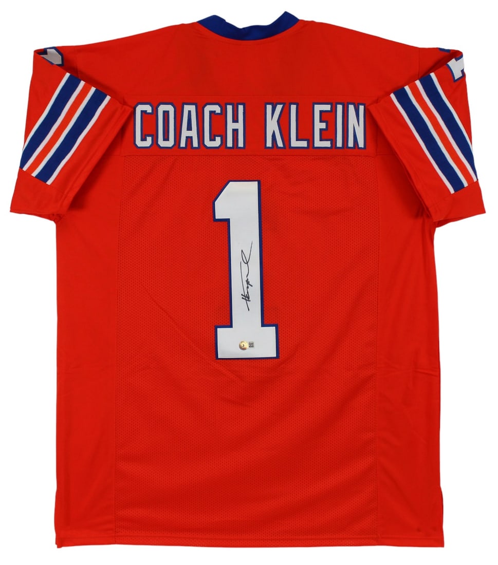 Coach Klein Orange Jersey Signed by Henry Winkler BAS Authenticated: Coach Klein Orange Jersey Signed by Henry Winkler BAS Authenticated This pre-owned orange Coach Klein jersey from The Waterboy is personally signed by Henry Winkler. The autograph is authenticated by 