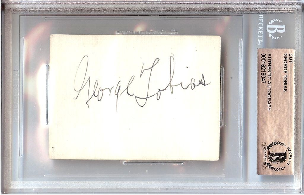 George Tobias Abner Kravitz Signed Cut Encapsulated by Beckett Authentication: George Tobias Abner Kravitz Signed Cut Encapsulated by Beckett Authentication This is an original cut signature of George Tobias, best known for his role as Abner Kravitz on the television show Bewitc