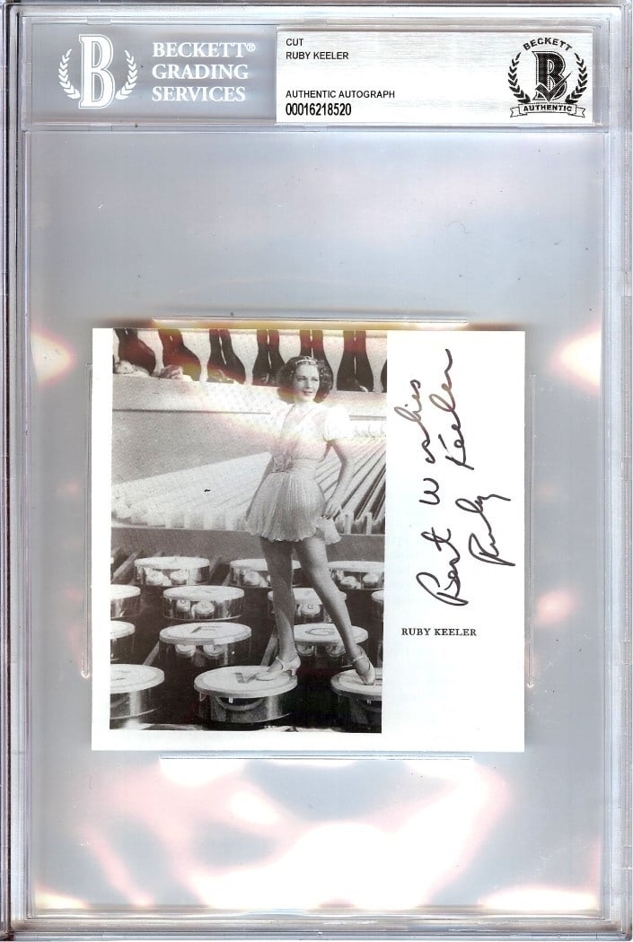 Beckett Authenticated Ruby Keeler Autograph Cut Signature Display: Beckett Authenticated Ruby Keeler Autograph Cut Signature Display This is an autographed cut signature of Ruby Keeler, renowned dancer and actress. The signature is authenticated and securely encased 