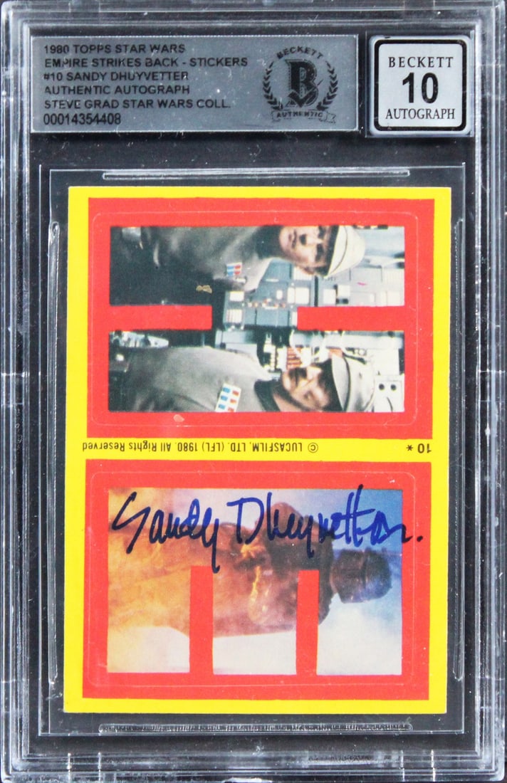 Star Wars ESB Sticker Card #10 Signed by Sandy Dhuyvetter BAS Gem Mint 10: Star Wars ESB Sticker Card #10 Signed by Sandy Dhuyvetter BAS Gem Mint 10 This is an original 1980 Star Wars: The Empire Strikes Back sticker card (#10) personally signed by Sandy Dhuyvetter. The auto