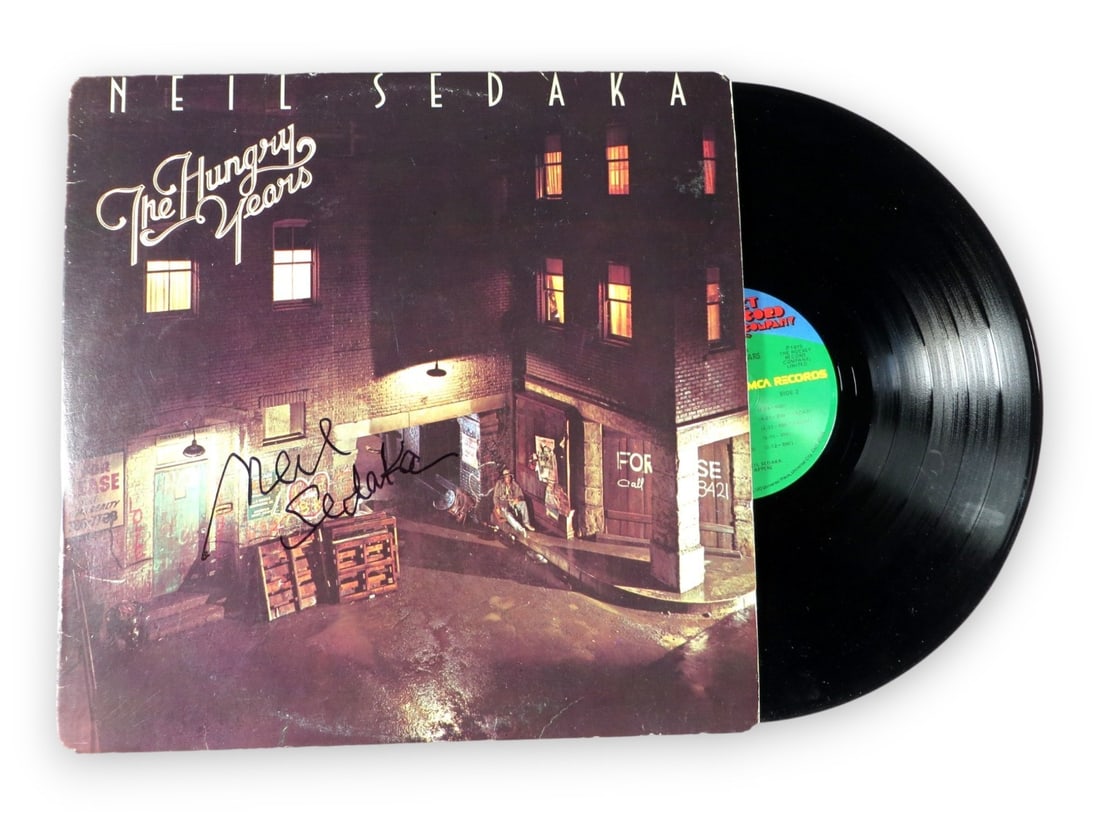 The Hungry Years Album Cover Signed by Neil Sedaka Beckett Authenticated: The Hungry Years Album Cover Signed by Neil Sedaka Beckett Authenticated This is an original record album cover for "The Hungry Years" that has been autographed by Neil Sedaka. The record(s) are inclu