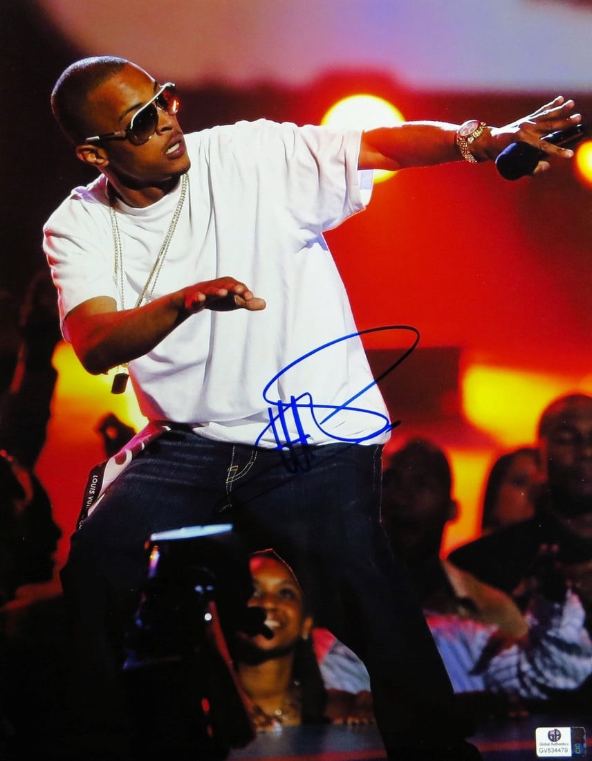 T.I. Authentic Signed 11X14 Photo with Global Authentics Certification: T.I. Authentic Signed 11X14 Photo with Global Authentics Certification This is an original 11x14 photo featuring T.I. performing on stage in a white shirt. The photo has been hand-signed by T.I. and c