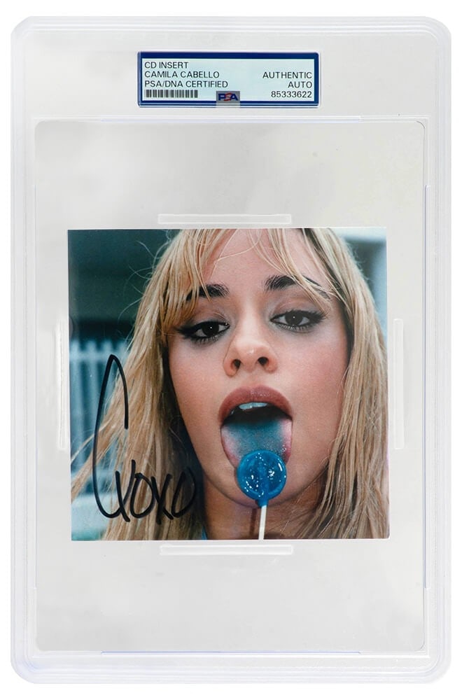 Camila Cabello Signed CD Insert C XOXO PSA DNA Authenticated 5x5: Camila Cabello Signed CD Insert C XOXO PSA DNA Authenticated 5x5 This is a signed 5x5 CD insert by Camila Cabello, featuring her signature along with 'C, XOXO'. The item is encapsulated by PSA/DNA for