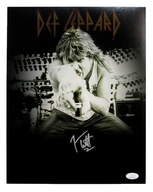 Joe Elliott Signed 11x14 Def Leppard Photo JSA Certified: Joe Elliott Signed 11x14 Def Leppard Photo JSA Certified This is an original 11x14 photo autographed by Joe Elliott of Def Leppard. The autograph is authenticated by JSA, and the item comes with a tam
