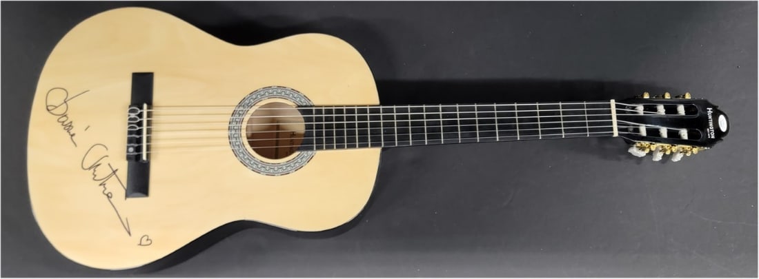 Basia Signed Acoustic Guitar Authenticated by JSA: Basia Signed Acoustic Guitar Authenticated by JSA This acoustic guitar has been hand signed by pop superstar Basia. The autograph is authenticated by James Spence Authentication (JSA), ensuring its au