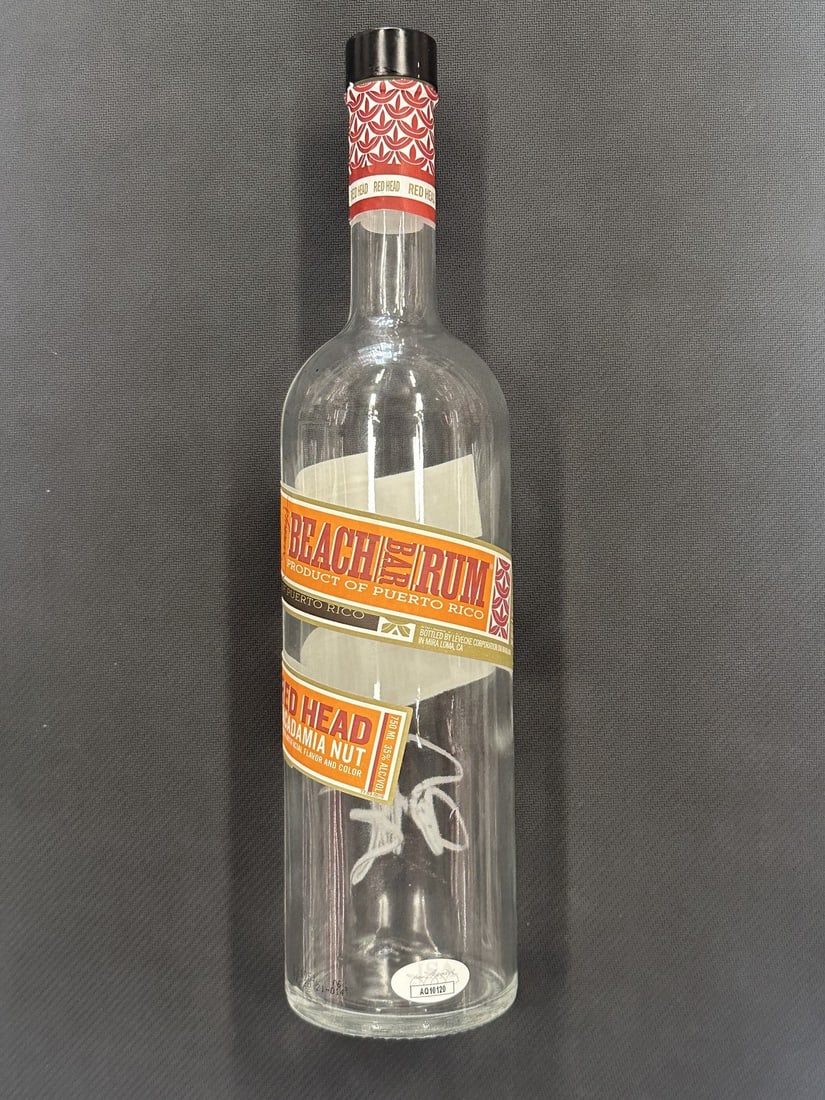 Sammy Hagar Autographed Beach Bar Bottle JSA Authenticated: Sammy Hagar Autographed Beach Bar Bottle JSA Authenticated This is an authentic Sammy Hagar autographed Beach Bar empty bottle, perfect for collectors and fans alike. The signature of the legendary si