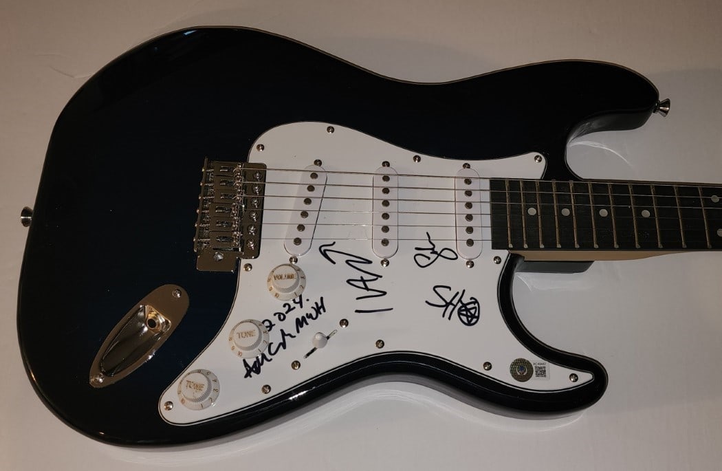 Men Without Hats Signed Electric Guitar JSA Authenticated: Men Without Hats Signed Electric Guitar JSA Authenticated This original electric guitar is autographed by the band Men Without Hats, featuring signatures from Ivan Doroschuk, Sho Murray, Adrian White,