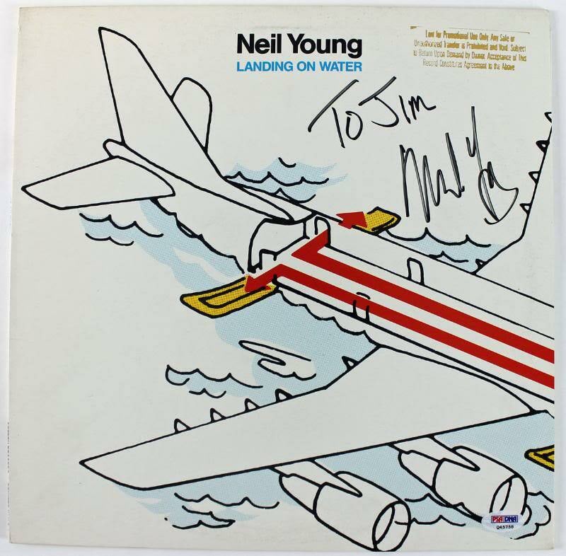 Neil Young Landing On Water Signed Album Cover with Vinyl PSA/DNA: Neil Young Landing On Water Signed Album Cover with Vinyl PSA/DNA This Neil Young 'Landing On Water' signed album cover comes complete with the vinyl record and has been certified authentic by PSA/DNA