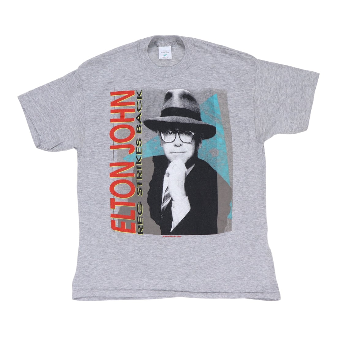 Vintage Gray 1985 Elton John Reg Strikes Back Poly Cotton T Shirt: Vintage Gray 1985 Elton John Reg Strikes Back Poly Cotton T Shirt This is an original vintage 1985 Elton John "Reg Strikes Back" shirt. It is not a modern reproduction and features no back graphics. T