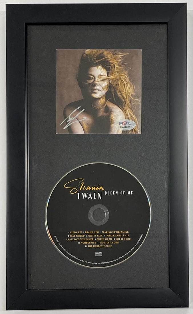 Shania Twain Queen of MC CD Autographed Framed PSA/DNA: Shania Twain Queen of MC CD Autographed Framed PSA/DNA This framed Queen of MC CD features a signature from the iconic Shania Twain, adding a personal touch to this collectible item. The autograph has