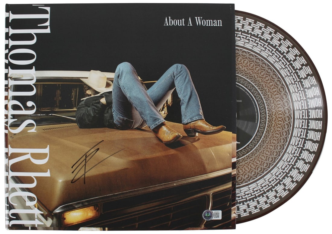 Thomas Rhett Signed About A Woman Album Flat with Vinyl BAS Authentication: Thomas Rhett Signed About A Woman Album Flat with Vinyl BAS Authentication This is an original autographed album flat of Thomas Rhett's "About A Woman," which includes both the album and vinyl. The it