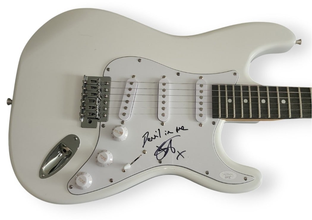 Joanne Shaw Taylor Signed Electric Guitar Devil In Me JSA Authenticated: Joanne Shaw Taylor Signed Electric Guitar Devil In Me JSA Authenticated This is a signed electric guitar by Joanne Shaw Taylor, featuring her autograph on the body. The guitar comes with a JSA sticker