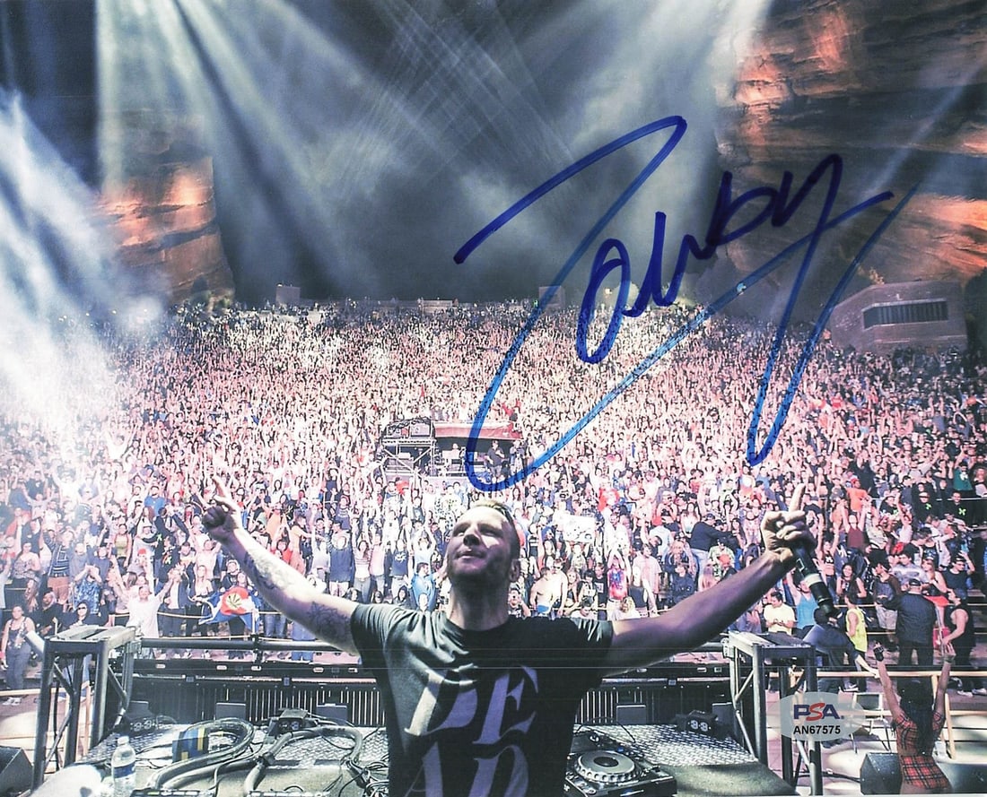 Zomboy Autographed 8x10 Photo PSA/DNA Certified: Zomboy Autographed 8x10 Photo PSA/DNA Certified This is an original 8x10 photograph featuring the signature of Zomboy, a renowned artist. The autograph has been authenticated by PSA/DNA, ensuring its 