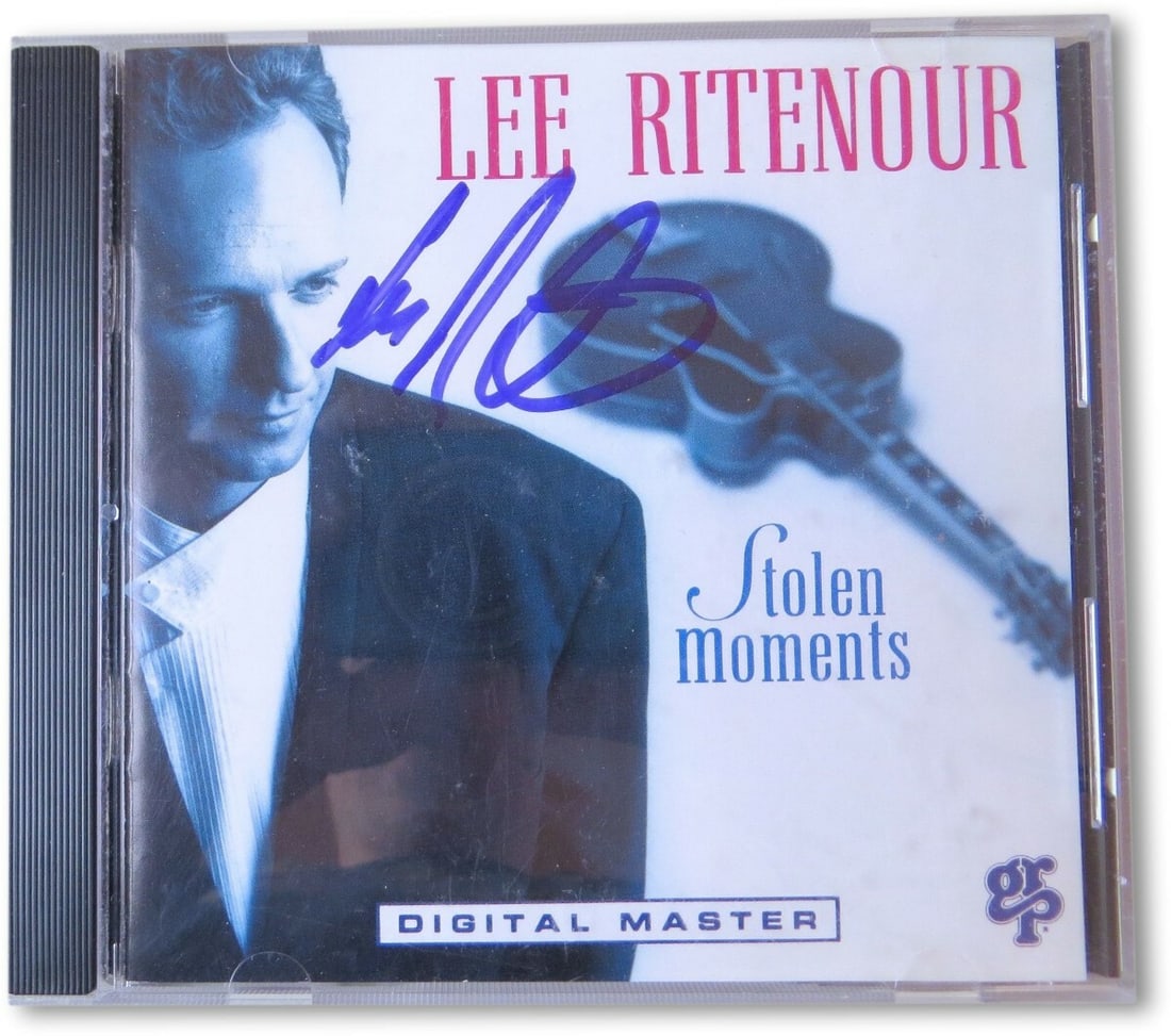 Lee Ritenour Autographed CD Insert Cover PSA/DNA Authenticated: Lee Ritenour Autographed CD Insert Cover PSA/DNA Authenticated This is an original autographed CD insert cover from renowned guitarist Lee Ritenour, featuring his signature. The item is authenticated