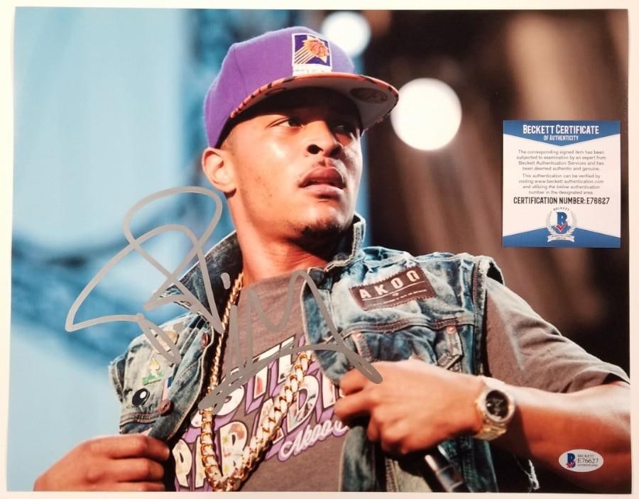11x14 Signed T.I. Photo With Beckett BAS Certificate Hip Hop Memorabilia: 11x14 Signed T.I. Photo With Beckett BAS Certificate Hip Hop Memorabilia This is an original 11x14 photograph signed by T.I. Clifford Harris Jr., the renowned hip hop and rap artist. The item includes