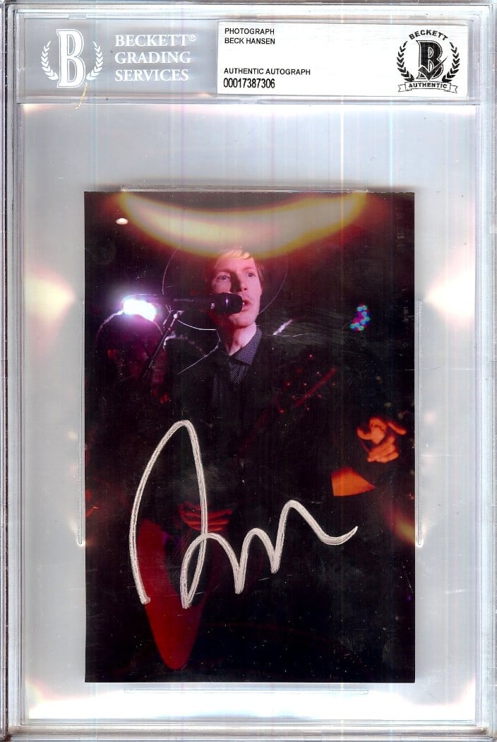 Beck Hansen Signed 4X6 Photo Spotlight JSA Authenticated: Beck Hansen Signed 4X6 Photo Spotlight JSA Authenticated This is an authentic 4x6 photograph of Beck Hansen, featuring his signature, which has been verified by James Spence Authentication (JSA). This
