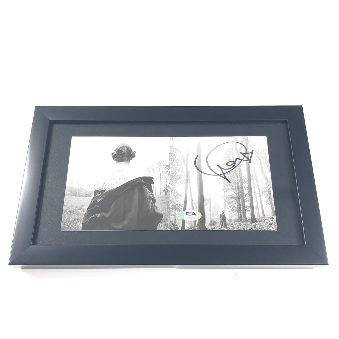Framed Folklore CD Album Signed by Taylor Swift with PSA/DNA Authentication: Framed Folklore CD Album Signed by Taylor Swift with PSA/DNA Authentication This is a framed CD album cover for Taylor Swift's "Folklore," featuring her authentic autograph. The item includes both the