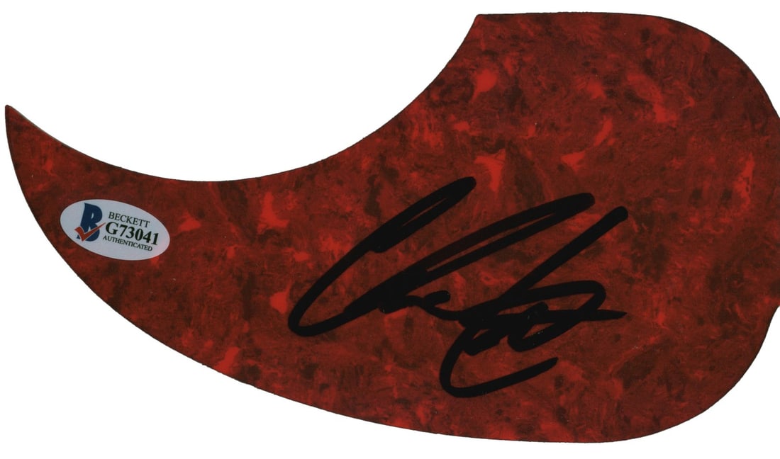 Chris Lane Signed Red Acoustic Guitar Pick Guard Beckett Authenticated: Chris Lane Signed Red Acoustic Guitar Pick Guard Beckett Authenticated This red acoustic guitar pick guard has been personally signed by musician Chris Lane. The item comes with authentication from Be