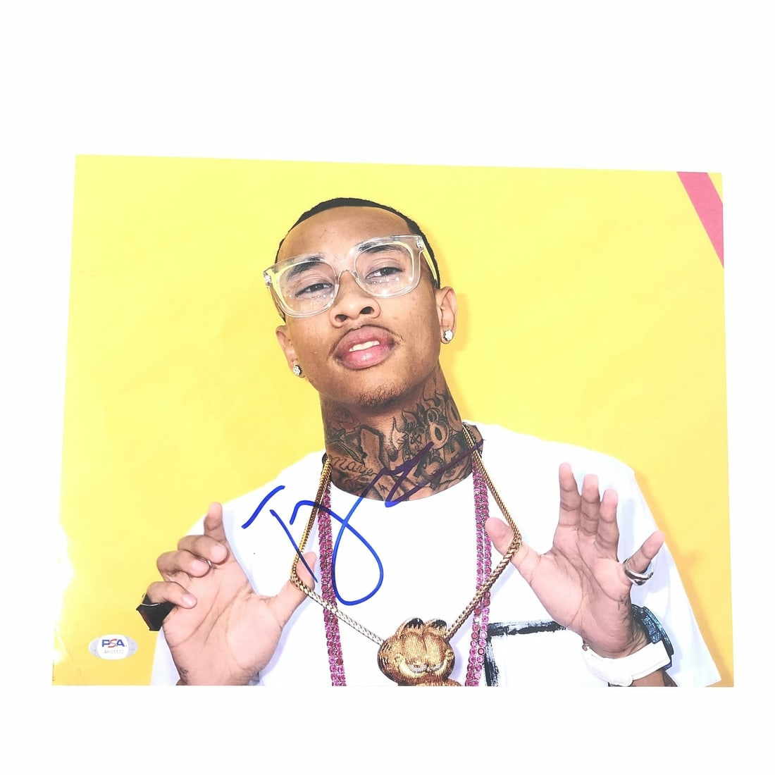 Tyga autographed 11x14 photo PSA DNA authenticated: Tyga autographed 11x14 photo PSA DNA authenticated This is a professionally printed 11x14 photograph featuring rapper Tyga. The photo has been personally autographed by Tyga and has undergone authenti