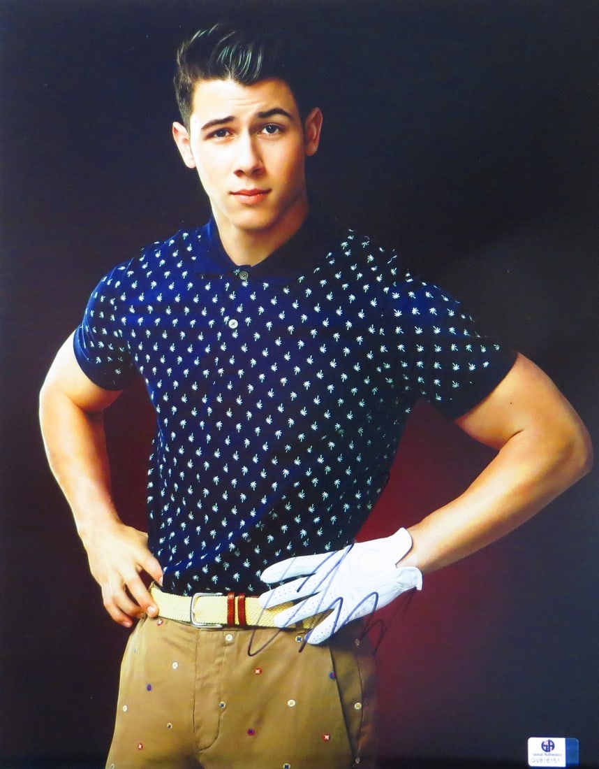 Nick Jonas Autographed 11x14 Photo GAI Certified Golf Shirt: Nick Jonas Autographed 11x14 Photo GAI Certified Golf Shirt Capture a piece of pop culture history with this authentic autographed photograph of Nick Jonas. This stunning 11x14 photo features Nick in