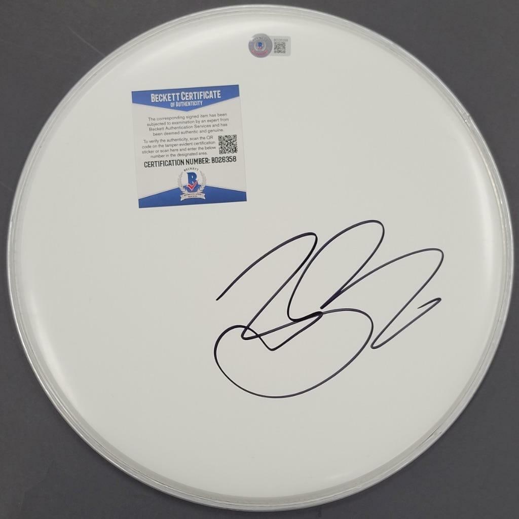 12 Inch Drumhead Autographed by Fuel Singer Brett Scallions Beckett Certified: 12 Inch Drumhead Autographed by Fuel Singer Brett Scallions Beckett Certified This is a 12-inch drumhead signed by Brett Scallions, the vocalist from Fuel. The autograph is authenticated by Beckett (B
