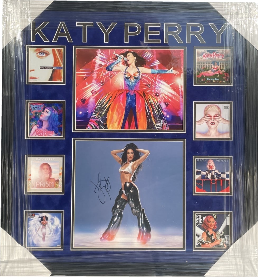 Katy Perry Signed Album Insert Custom Framed JSA Authenticated 26x28: Katy Perry Signed Album Insert Custom Framed JSA Authenticated 26x28 This is an original autographed album insert from Katy Perry's 'Woman's World EP', custom framed to enhance its display. The frame 