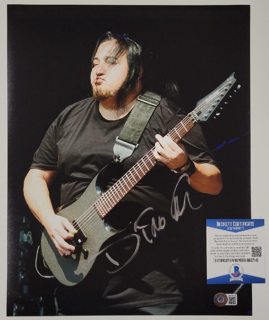 Autographed 11x14 Photograph Signed by Dino Cazares of Fear Factory with Beckett COA: Autographed 11x14 Photograph Signed by Dino Cazares of Fear Factory with Beckett COA Original 11x14 photograph signed by Dino Cazares of Fear Factory, authenticated by Beckett. This pre-owned collecti