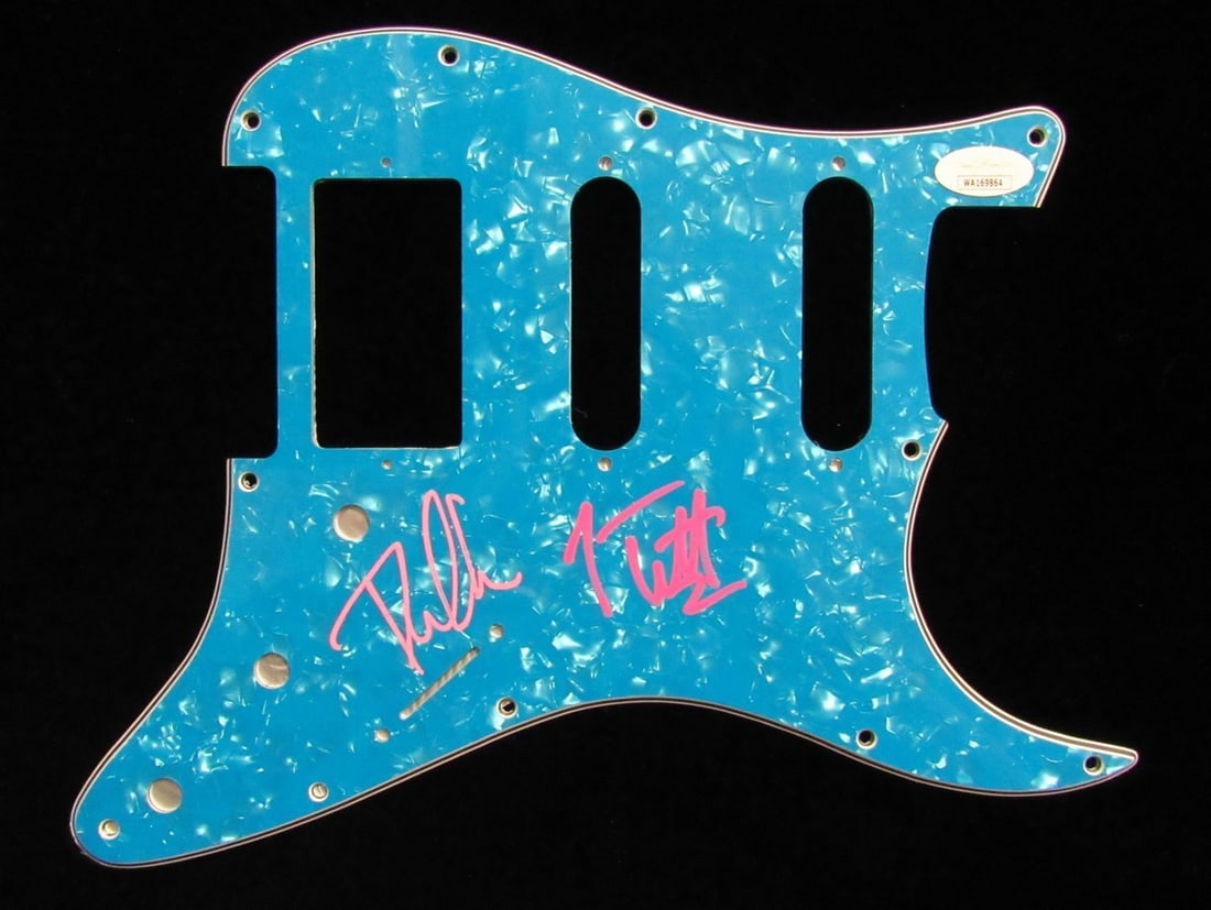 Def Leppard Pick Guard Signed by Joe Elliott and Phil Collen JSA: Def Leppard Pick Guard Signed by Joe Elliott and Phil Collen JSA This is an original guitar pick guard hand signed by Joe Elliott and Phil Collen of Def Leppard. The autographs are authenticated by Ja