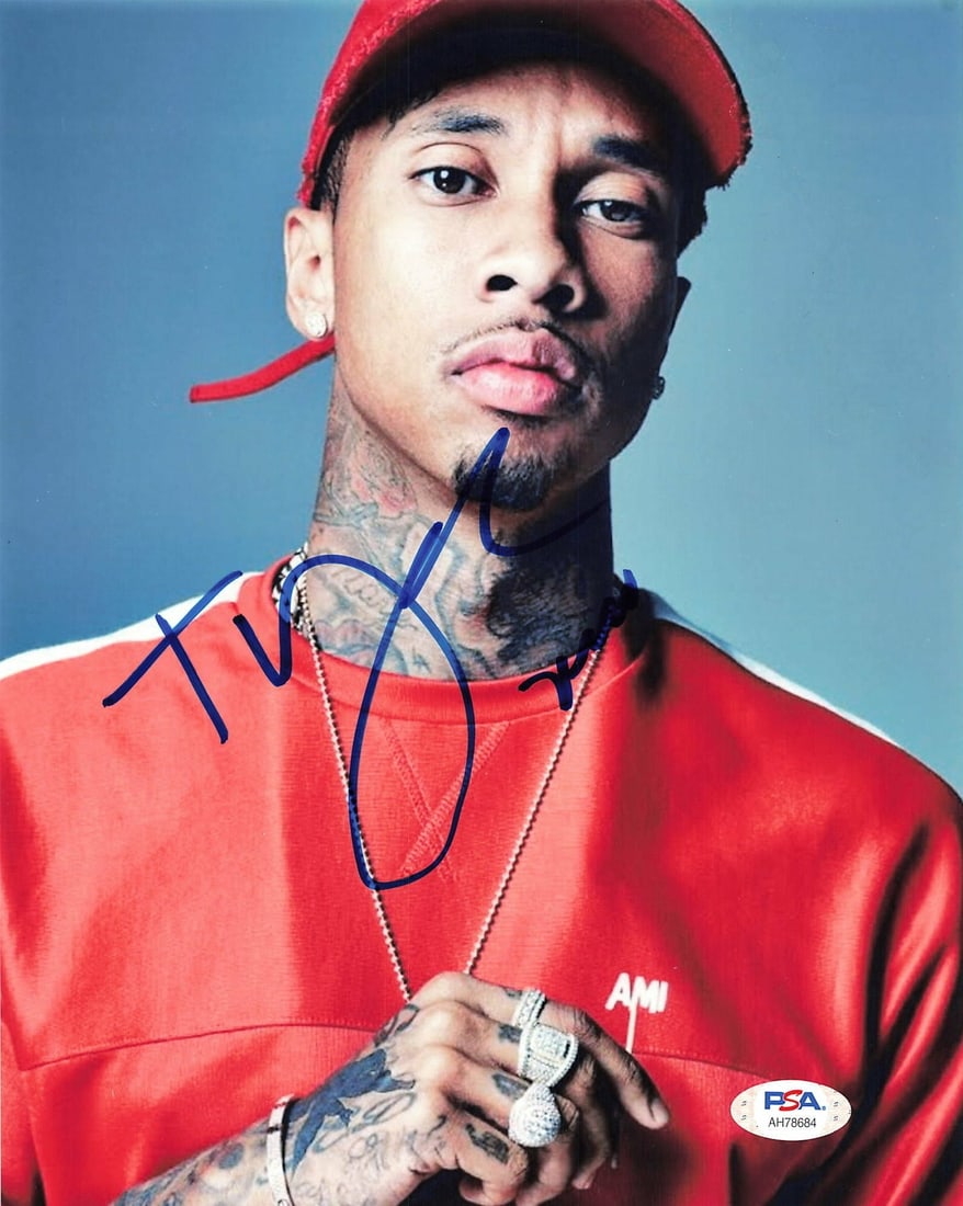 Tyga autographed PSA DNA 8x10 photo rapper: Tyga autographed PSA DNA 8x10 photo rapper This is a professionally printed 8x10 photograph featuring the autograph of rapper Tyga. The photo is an original item from the United States and has been au
