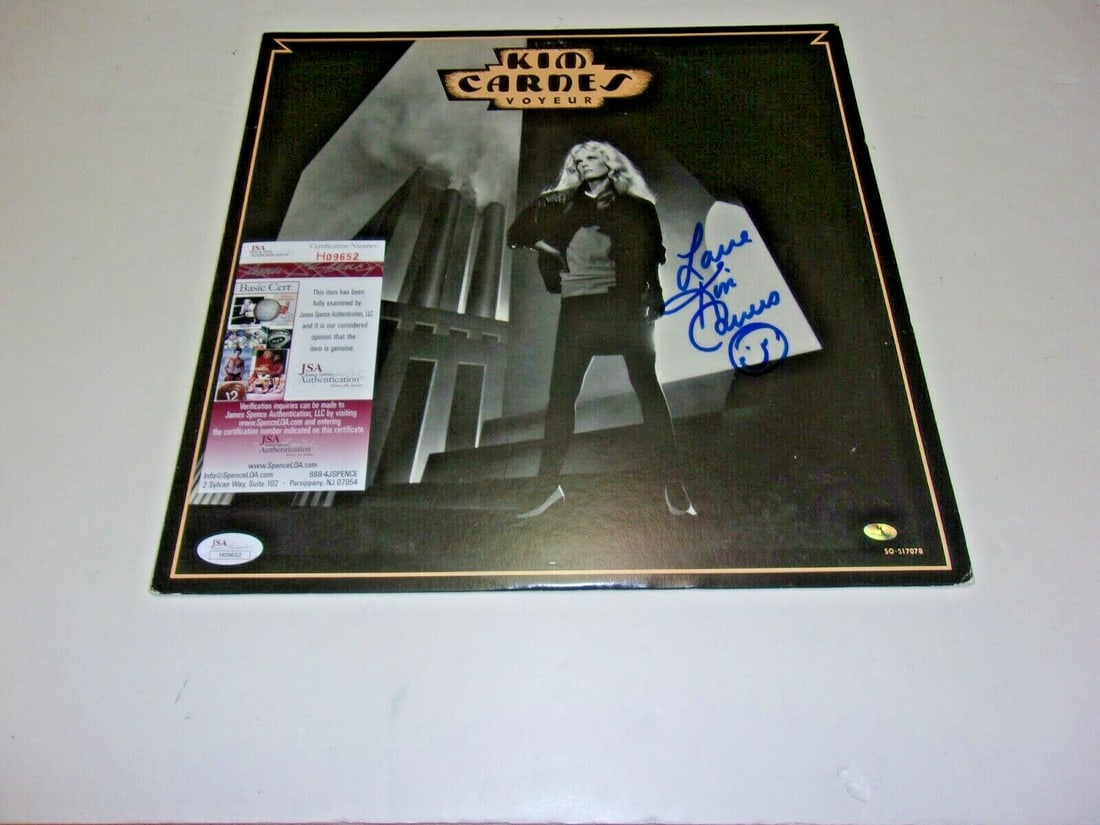 Signed Kim Carnes Voyeur LP Album with JSA COA Authentication: Signed Kim Carnes Voyeur LP Album with JSA COA Authentication This is an original LP record album for "Voyeur" signed by the famous musician Kim Carnes. The album is a pre-owned item and comes from th