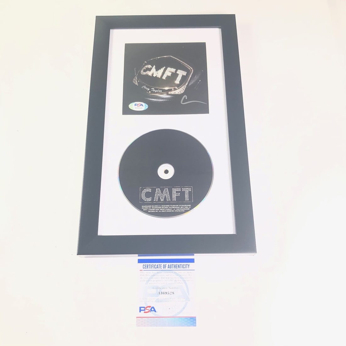 Corey Taylor Signed Framed CD Cover PSA/DNA Authentic Slipknot: Corey Taylor Signed Framed CD Cover PSA/DNA Authentic Slipknot This is a framed CD album cover of Corey Taylor's CMFT, featuring a bold autograph from the artist himself. The signature has been authen