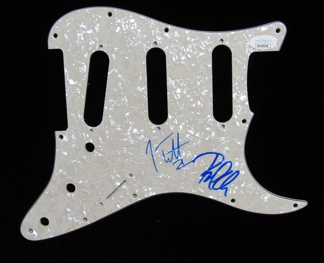 Def Leppard Pick Guard Signed by Joe Elliott and Phil Collen JSA: Def Leppard Pick Guard Signed by Joe Elliott and Phil Collen JSA This is an original guitar pick guard hand signed by Joe Elliott and Phil Collen of Def Leppard. The signatures have been authenticated