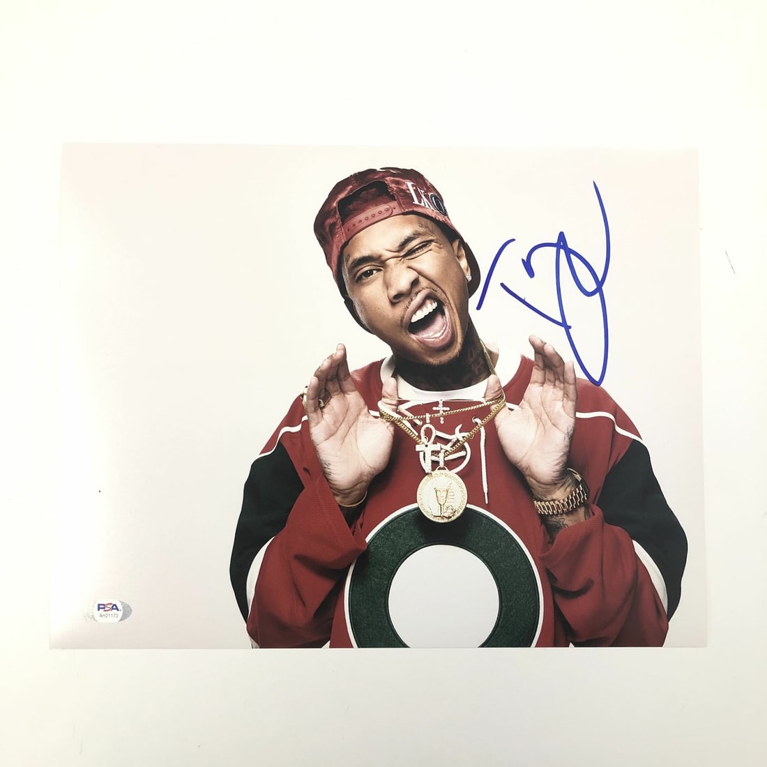 11x14 Autographed Tyga Photograph PSA/DNA Certified Music Memorabilia: 11x14 Autographed Tyga Photograph PSA/DNA Certified Music Memorabilia This is a professionally printed 11x14 photograph featuring the autograph of rapper Tyga. The signature has been authenticated by 