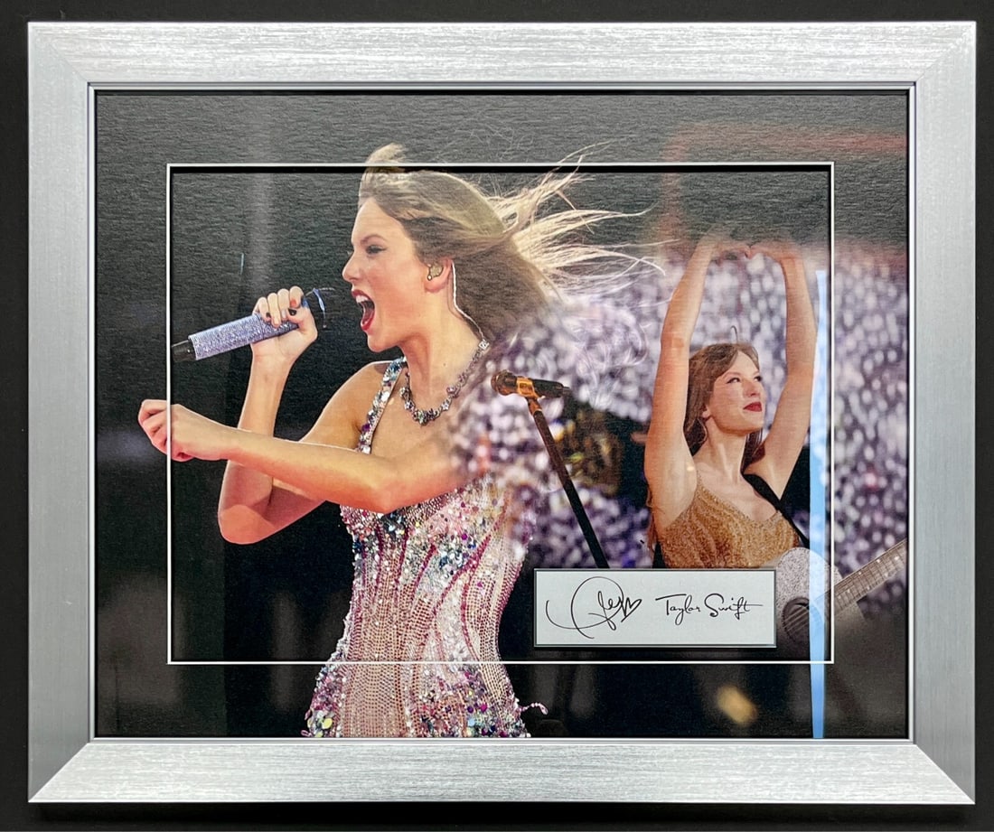 Taylor Swift Laser Engraved Signature Custom Framed Display 23 x 19 - Reproduction: Taylor Swift Laser Engraved Signature Custom Framed Display 23 x 19 - Reproduction This stunning custom framed display features the iconic pop music superstar, Taylor Swift. Measuring 23 x 19 inches, 