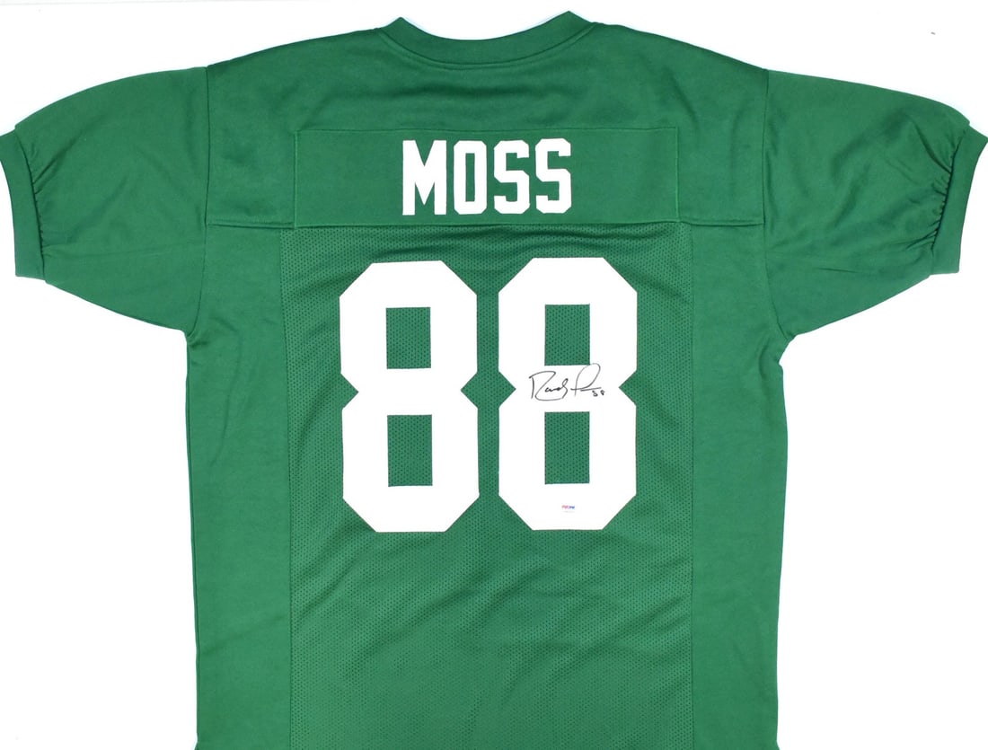 Randy Moss signed Marshall University football jersey black: Randy Moss signed Marshall University football jersey black This is a green college style football jersey autographed by Randy Moss. The jersey represents Marshall University and is an original item.