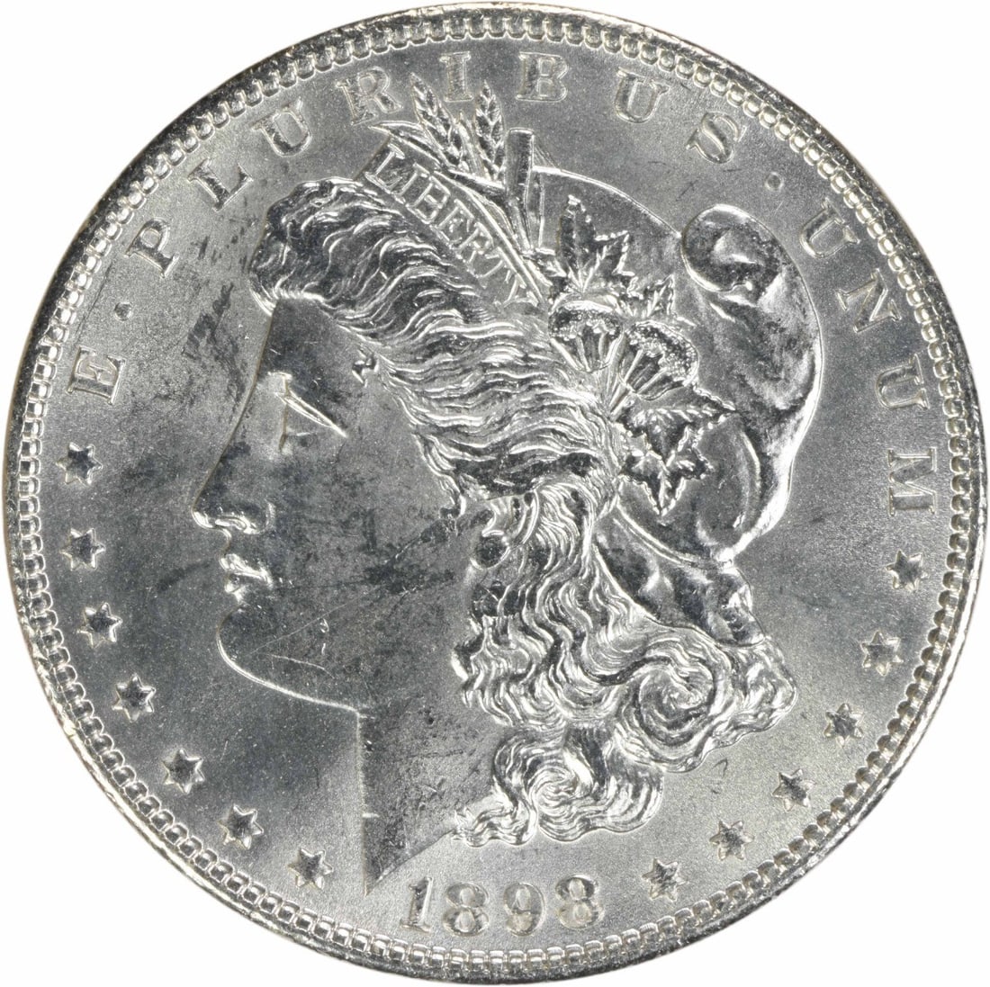 Uncirculated 1898 Silver Morgan Dollar BU No Mint Mark Uncertified: Uncirculated 1898 Silver Morgan Dollar BU No Mint Mark Uncertified This 1898 Morgan Silver Dollar is an uncirculated coin featuring brilliant uncirculated (BU) quality. It is composed of silver and wa