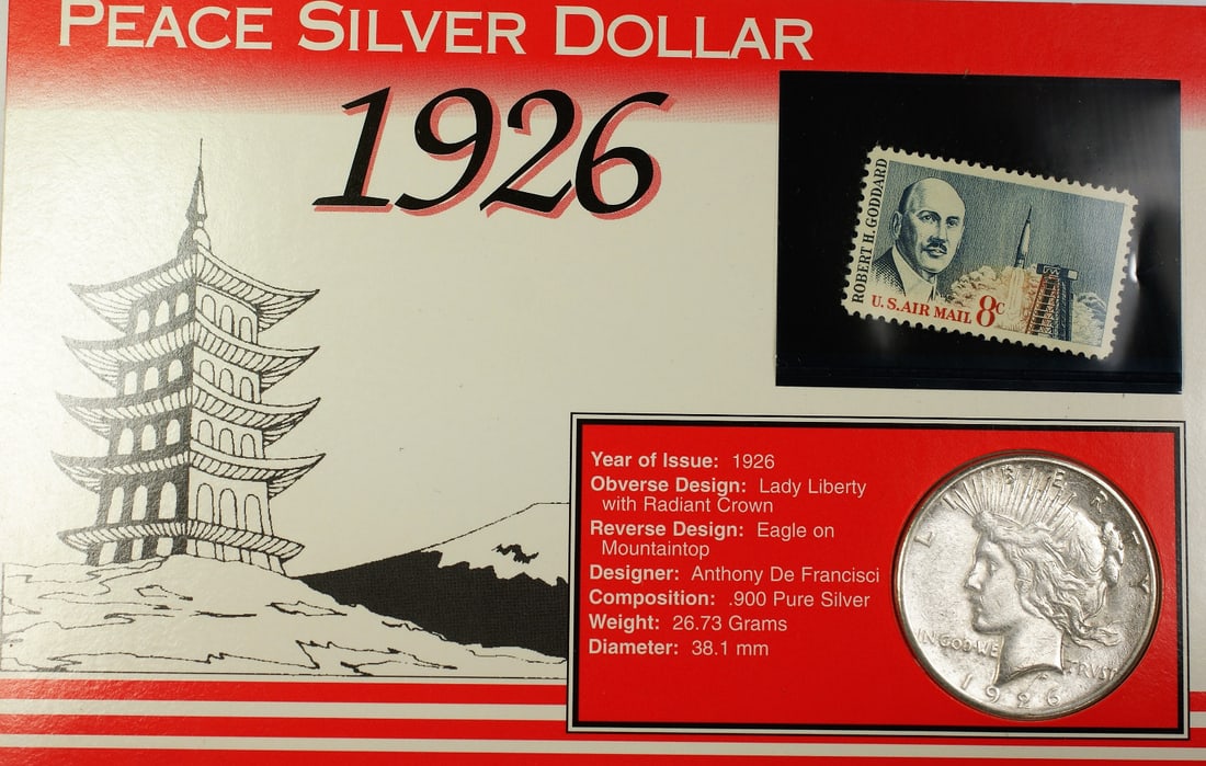 Circulated 1926-S Peace Dollar with 8 Cent Goddard Stamp and Fact Sheet: Circulated 1926-S Peace Dollar with 8 Cent Goddard Stamp and Fact Sheet This lot includes a 1926-S Peace Silver Dollar coin from the San Francisco Mint. The coin is composed of silver and has been cir