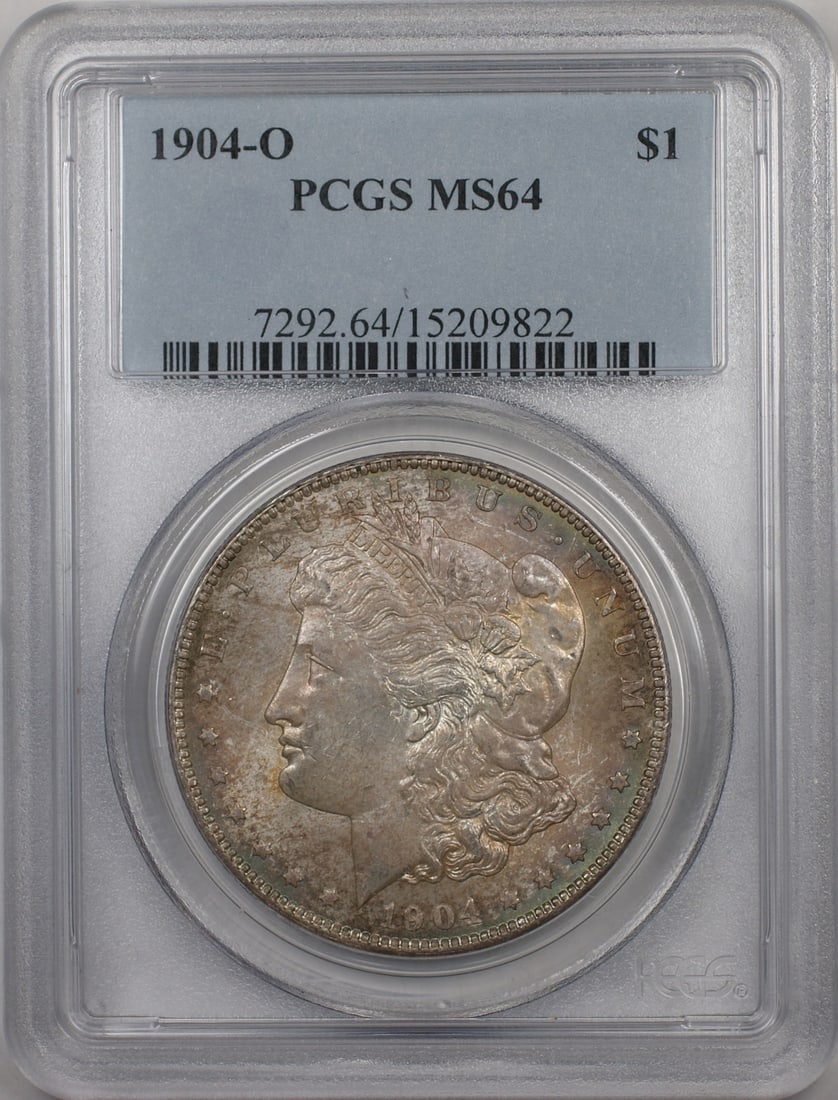PCGS MS-64 1904-O Morgan Dollar Silver Coin New Orleans Mint: PCGS MS-64 1904-O Morgan Dollar Silver Coin New Orleans Mint This is a 1904-O Morgan Silver Dollar $1 coin, graded MS-64 by PCGS. The coin was minted in New Orleans and is composed of silver. It is an