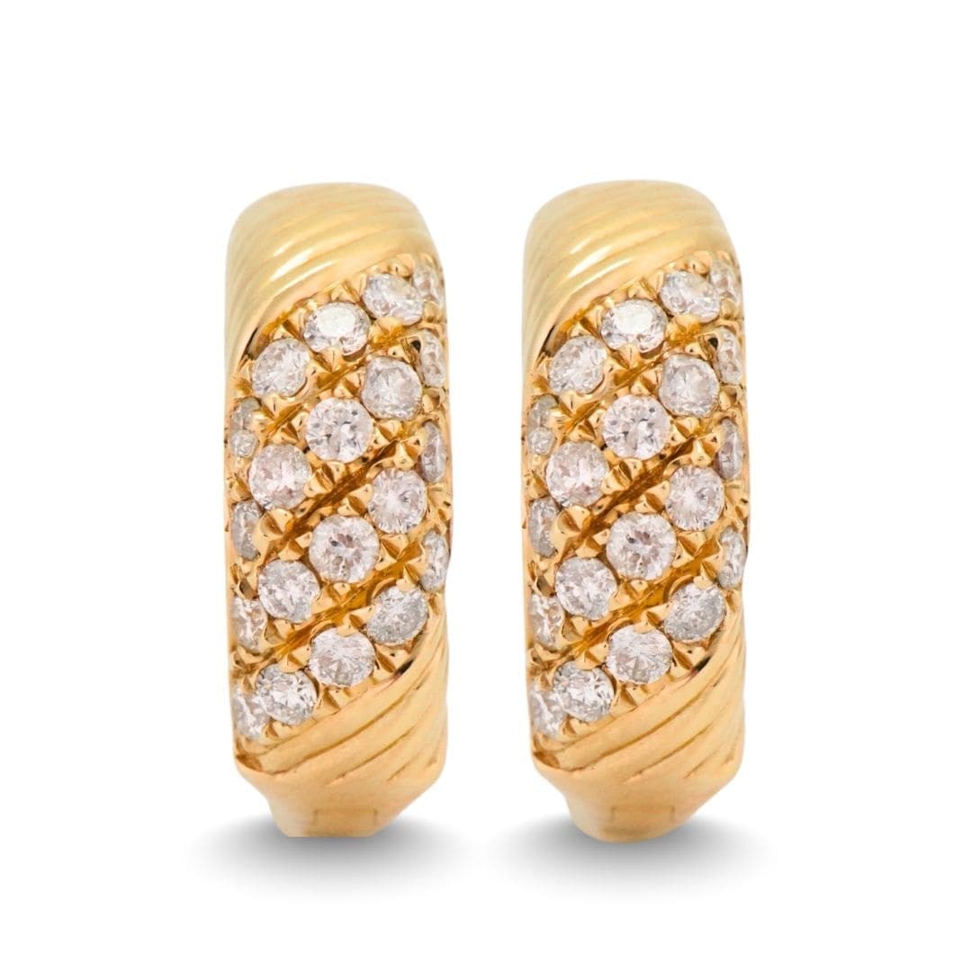 14K Gold Hoop Earrings with 0.70 ctw Diamonds: 14K Gold Hoop Earrings with 0.70 ctw Diamonds These elegant hoop earrings are crafted from 14K yellow gold and set with round brilliant cut natural diamonds totaling 0.70 carats. The diamonds are grad