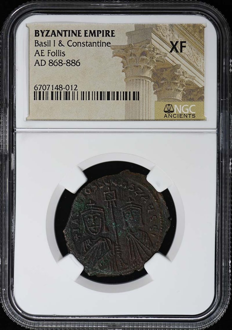 Byzantine Empire AE Follis Coin NGC XF40 Basil I and Constantine: Byzantine Empire AE Follis Coin NGC XF40 Basil I and Constantine This AE Follis coin from the Byzantine Empire features the reign of Basil I and Constantine. It is certified by NGC with a grade of XF4