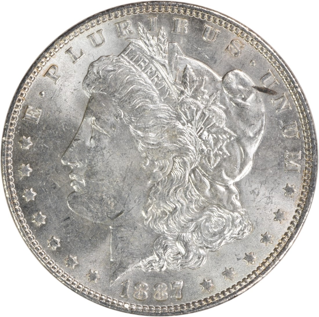 1887 Silver Morgan Dollar Brilliant Uncirculated Uncertified Coin: 1887 Silver Morgan Dollar Brilliant Uncirculated Uncertified Coin This 1887 Morgan Silver Dollar is an uncirculated coin featuring a brilliant uncirculated (BU) grade. It is composed of silver and was