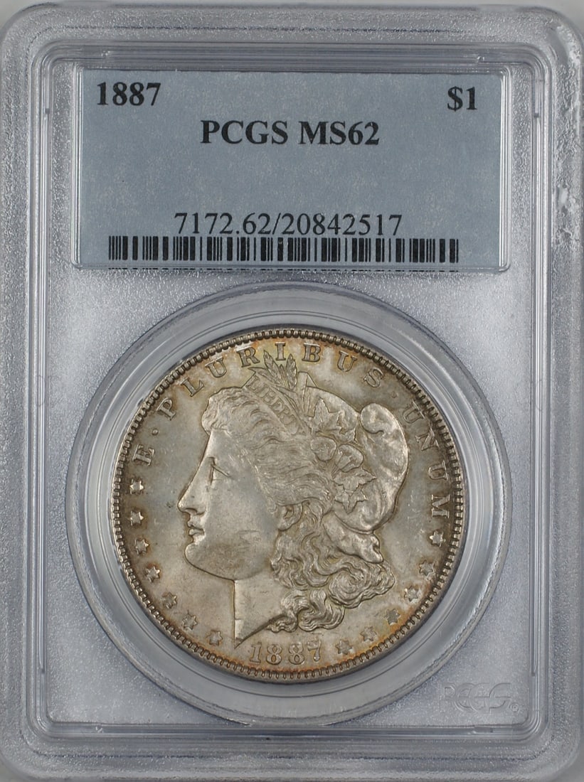 PCGS MS62 1887 Morgan silver dollar toned: PCGS MS62 1887 Morgan silver dollar toned This 1887 Morgan Silver Dollar is graded MS-62 by PCGS and features attractive toning on both the obverse and reverse. Struck in Philadelphia, this uncirculat