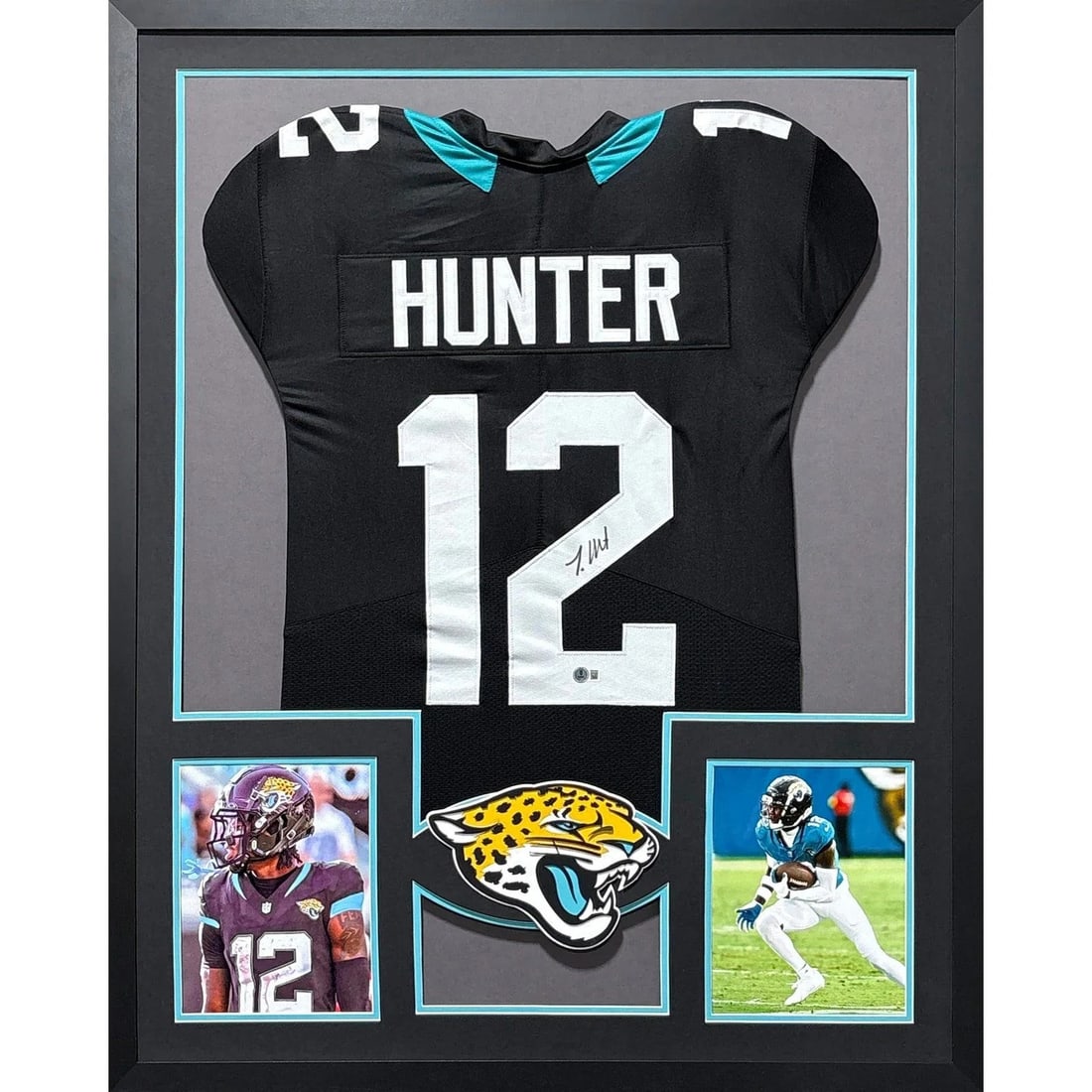 Travis Hunter Signed Framed Jaguars Jersey Beckett Authenticated: Travis Hunter Signed Framed Jaguars Jersey Beckett Authenticated This is an autographed framed jersey of Travis Hunter, featuring the Jacksonville Jaguars logo. The jersey is authenticated by Beckett,